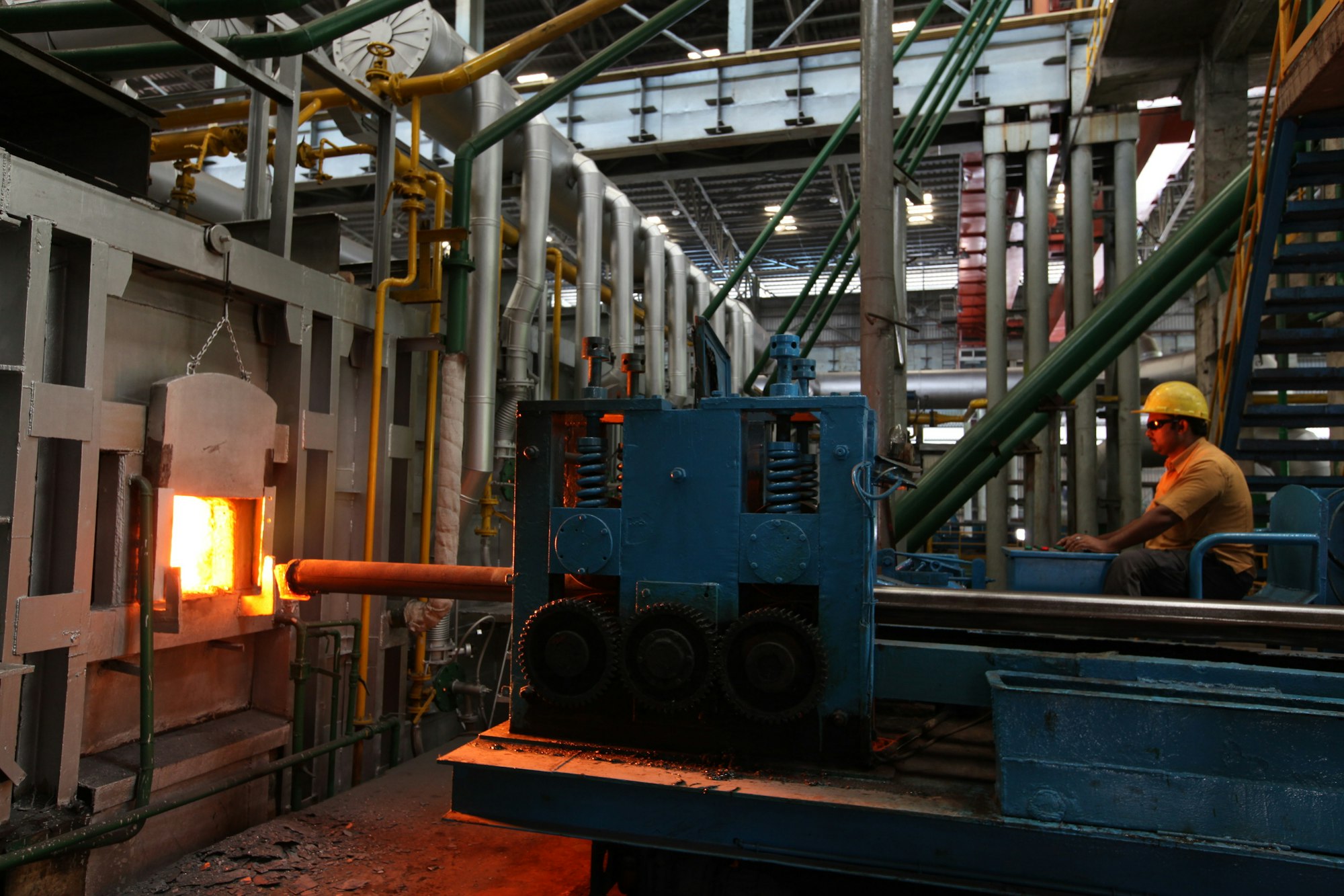 Industrial furnace with a glowing opening on a production line