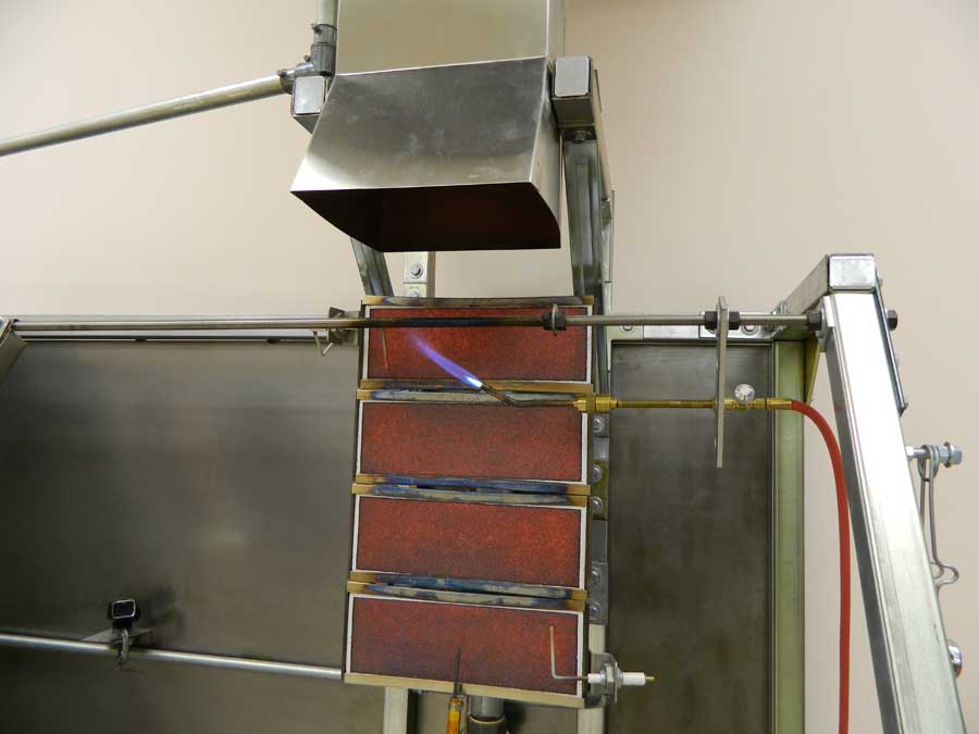 Close up of radiant heat panel and pilot burner